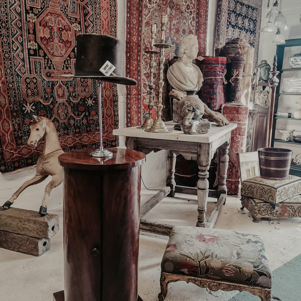 the interior of our shop, showing multiple antique pieces