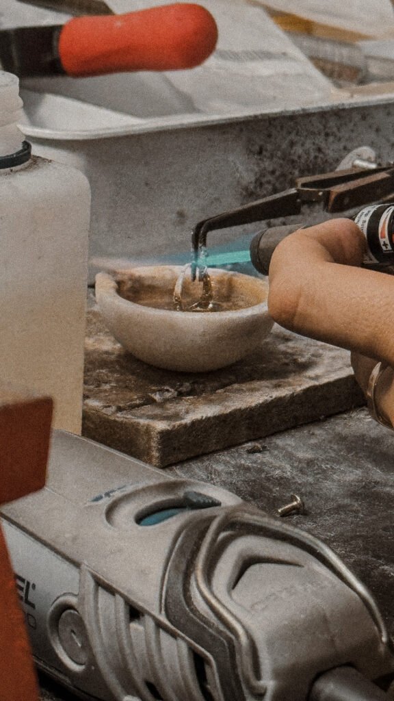 A jeweller rejoining a broken ring